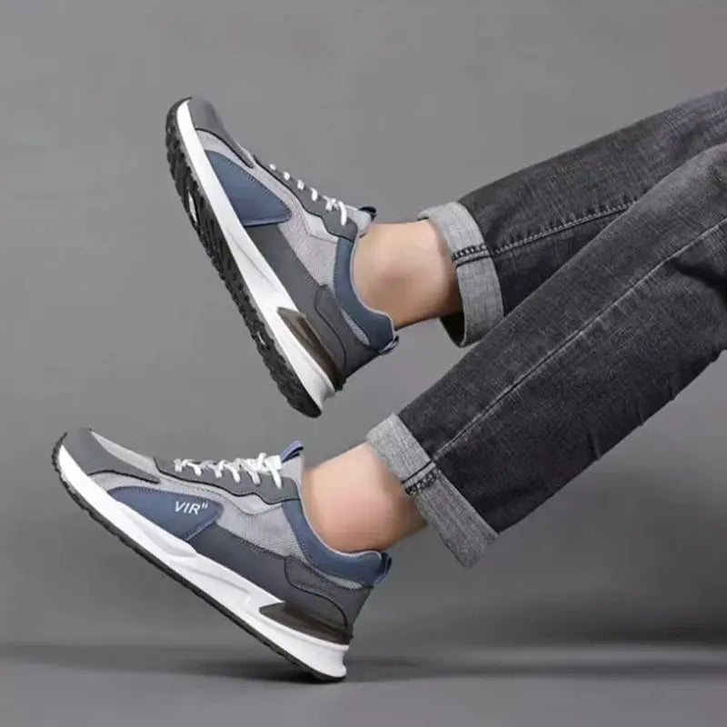 Casual yet sporty men's lace-up sneakers with a breathable mesh upper in a color block style, ideal for running and everyday athleisure.