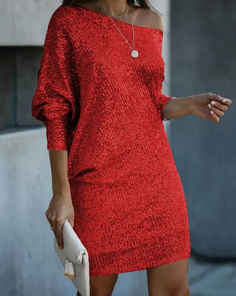 Elegant woman posing in a simplicity fashion v-neck mid-length off shoulder dress with intricate beadwork on the oblique shoulder.
