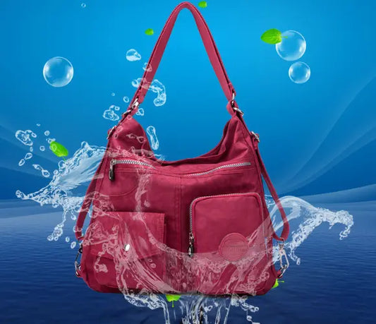 Stylish waterproof crossbody bag for women in black, made of durable nylon cloth. Perfect for everyday use or special occasions.