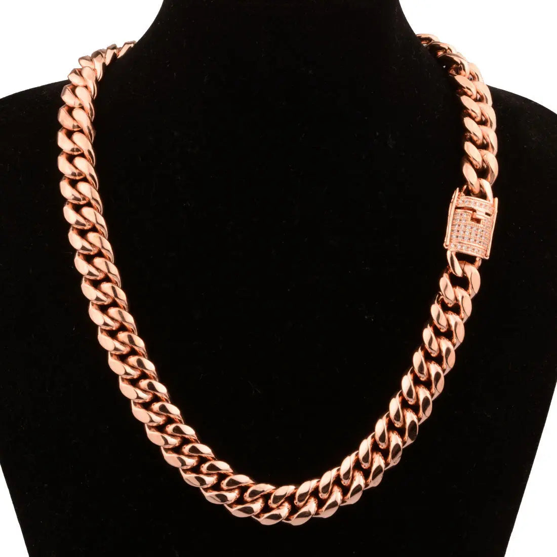 a alt= A rose gold chain necklace on a mannequin.