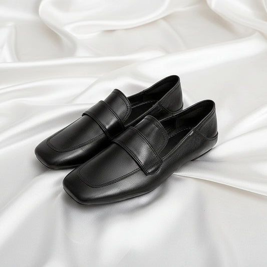 Womens black French-style retro flat shoes with a square toe and smooth faux leather finish.
