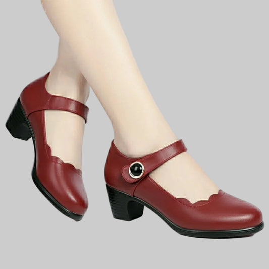 Close-up of the secure buckle closure and soft leather texture on women's block heels.