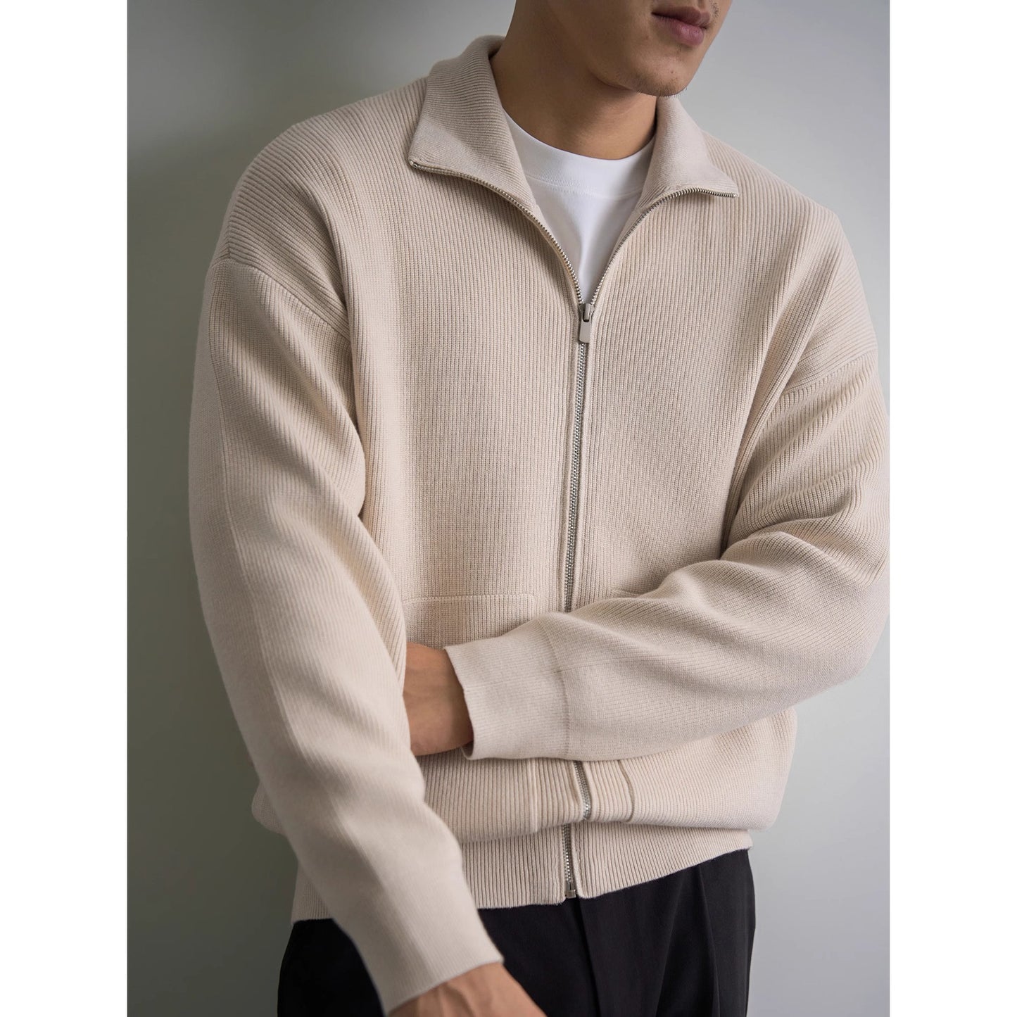 
Front view of a premium men's heritage espresso brown full-zip standing collar knit cardigan sweater jacket with front pockets.


