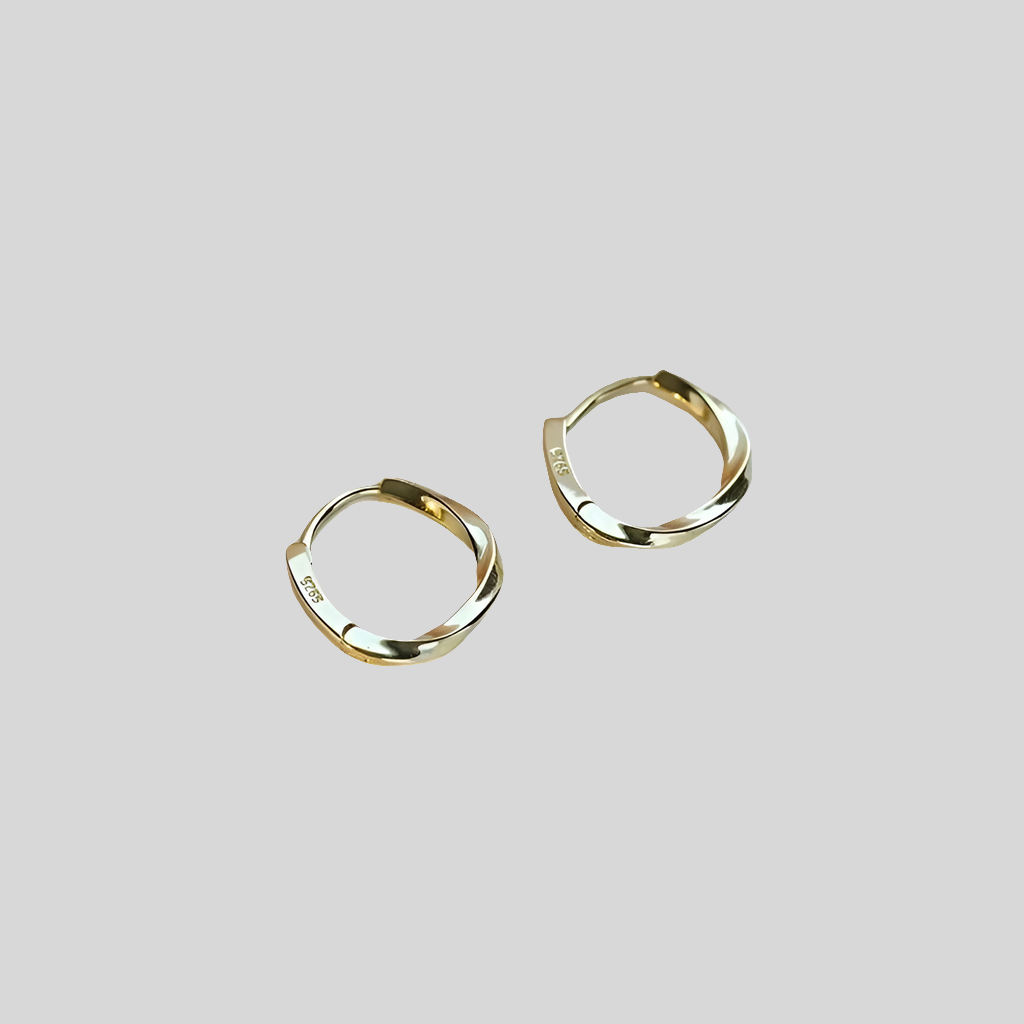 Signature circular hoop earrings in 925 sterling silver with a polished geometric design for women.