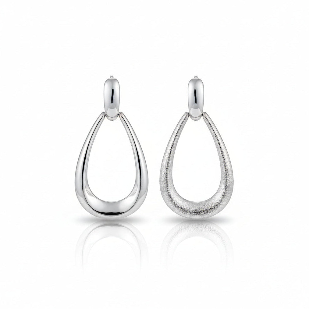 Elegant gold-tone earrings featuring a polished teardrop design with a smooth sweet-style finish | Artisan Prestige