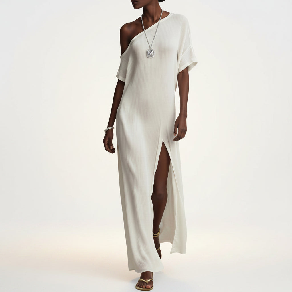 Close-up detail shot of the Aurora off-shoulder slit maxi dress, showcasing the soft fabric texture, relaxed mid-waist A-line tailoring, and clean short sleeve stitching.
