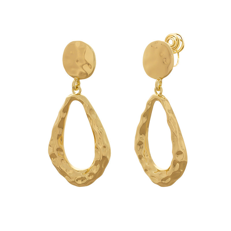 Gold hollow waterdrop pendant earrings in a polished minimalist style for women