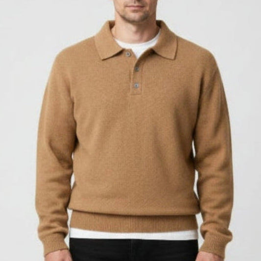 A man wearing a camel brown knit polo sweater over a white undershirt, shown against a plain light gray background. 