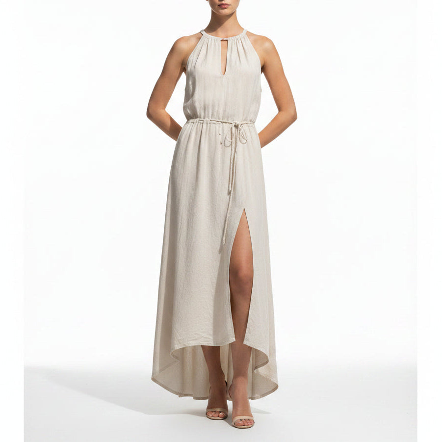 Woman wearing Samantha premium linen maxi dress in a minimalist, sunlit setting.