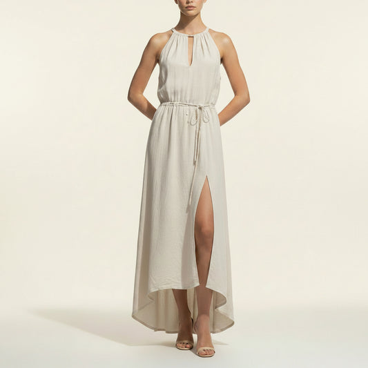 Woman wearing Samantha premium linen maxi dress in a minimalist, sunlit setting.